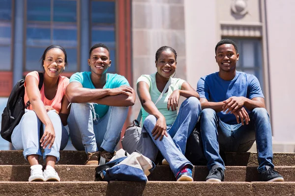 depositphotos_70622593-stock-photo-students-sitting-outside-college-building